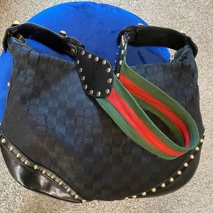 Gucci Pelham Stripe Studded bag has some wear on the upper corners.